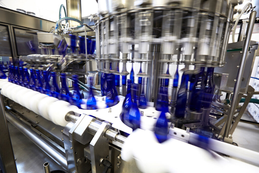 Sake Bottles Moving Through a Bottling Line